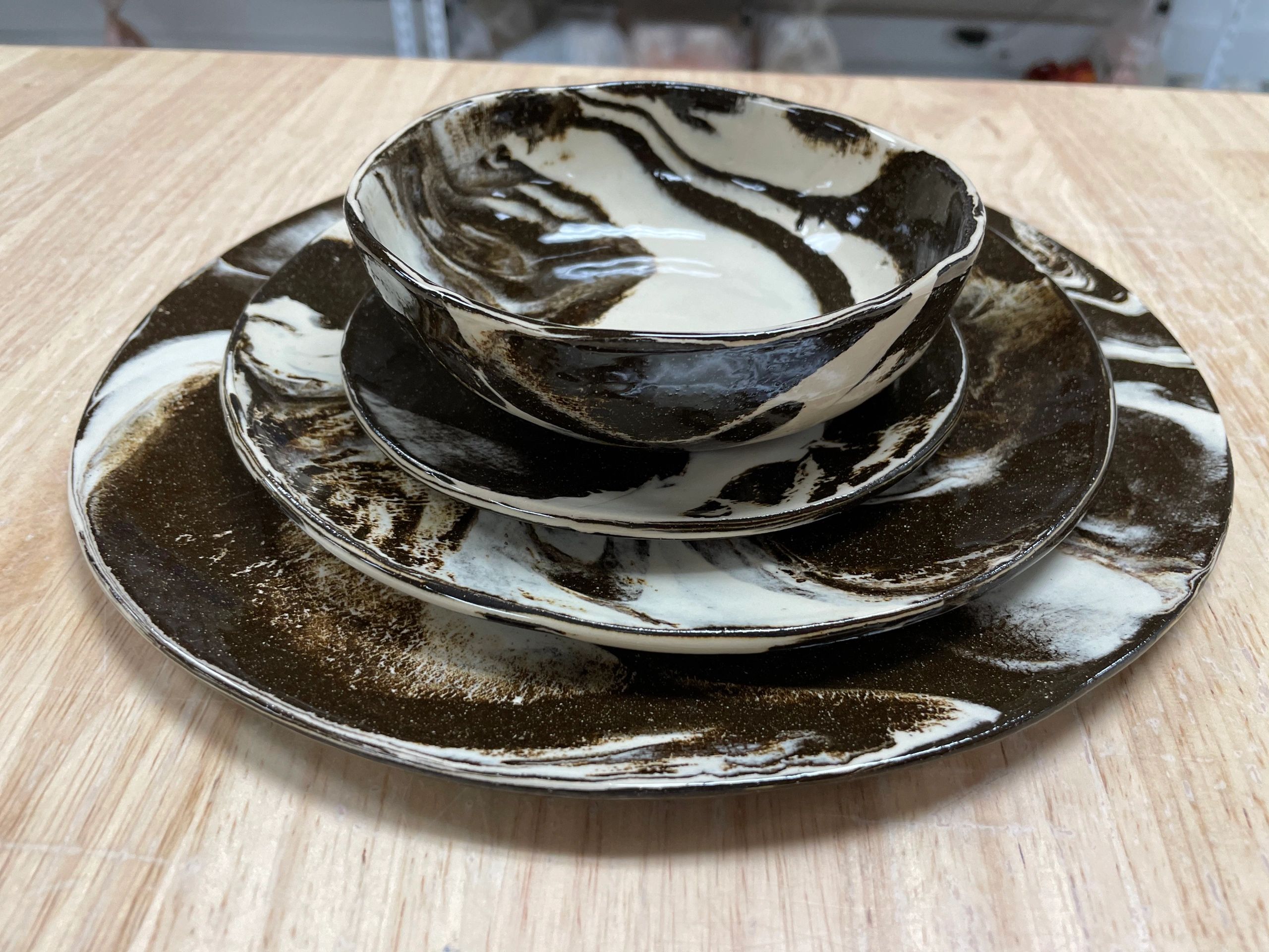 Marbled black and white ceramic plates with bowl
